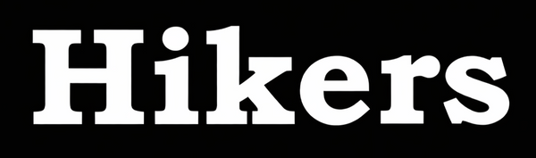 White Hikers brand logo featuring bold, serif typography centered on a solid black background.
